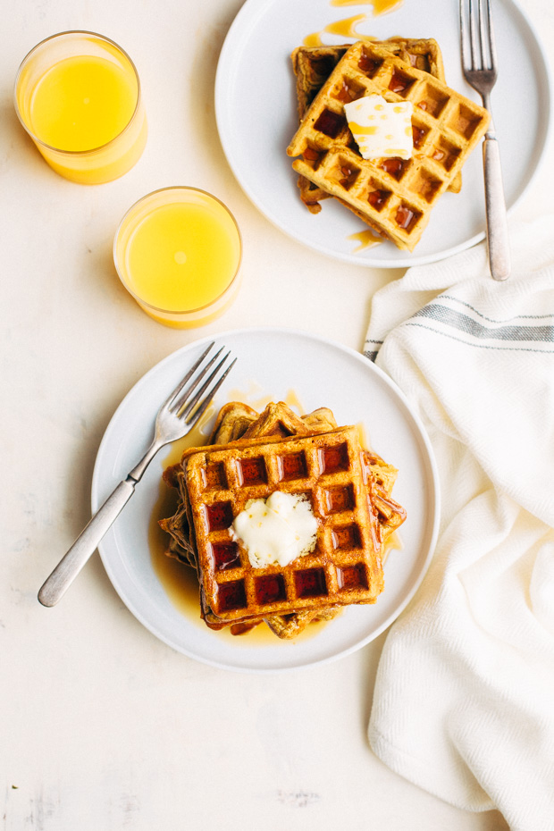 Buttermilk Pumpkin Waffles - The more tender and fluffy waffles that are spiced with fall flavors! Drizzled with maple syrup, they're perfect for fall breakfast! #waffles #pumpkinwaffles #buttermilkwaffles | Littlespicejar.com