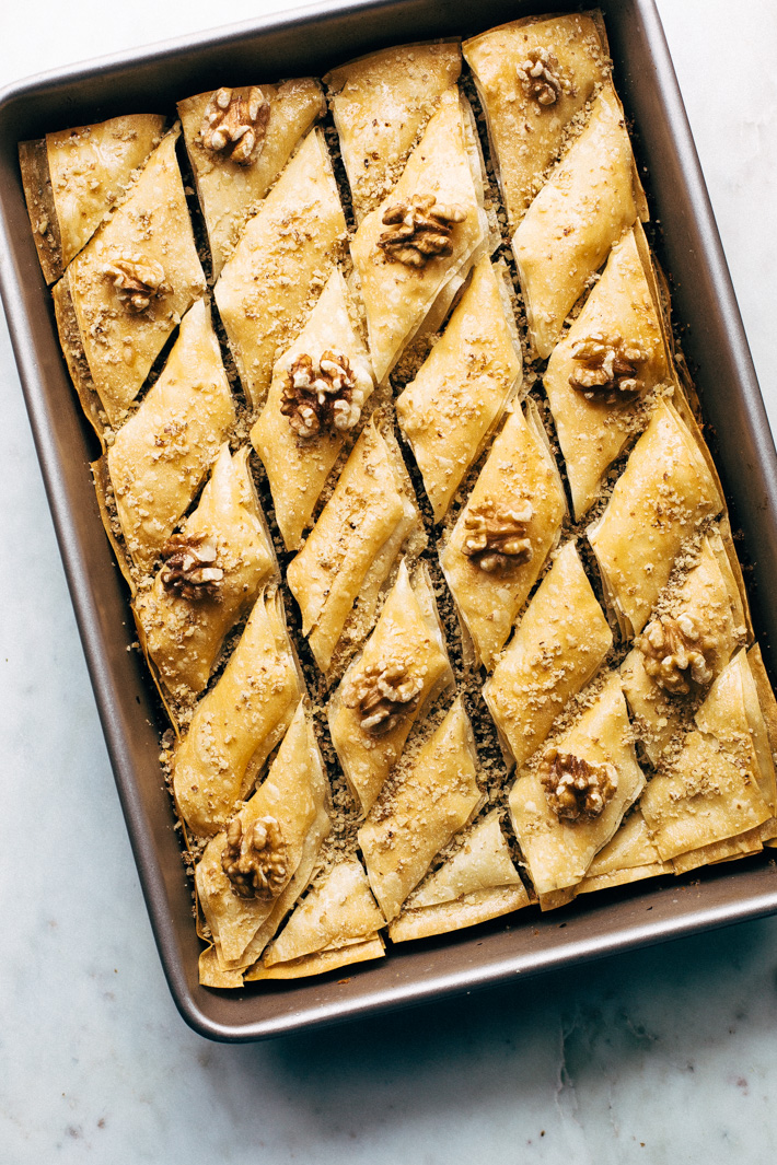 Holiday Walnut Baklava - buttery phyllo with layers of ground walnuts in between and drizzled with a homemade simple syrup with sweet orange blossom and rose water! So good! #baklava #walnutbaklava #lebanesebaklava | Littlespicejar.com