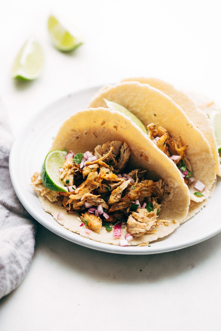 Pressure Cooker Crispy Chicken Carnitas - The easiest way to make carnitas! This instant pot recipe makes the most delicious carnitas! Top with lots of cilantro, onions, sautéed cabbage, and homemade chipotle sauce! #instantpot #carnitas #chickencarnitas #pressurecooker | Littlespicejar.com