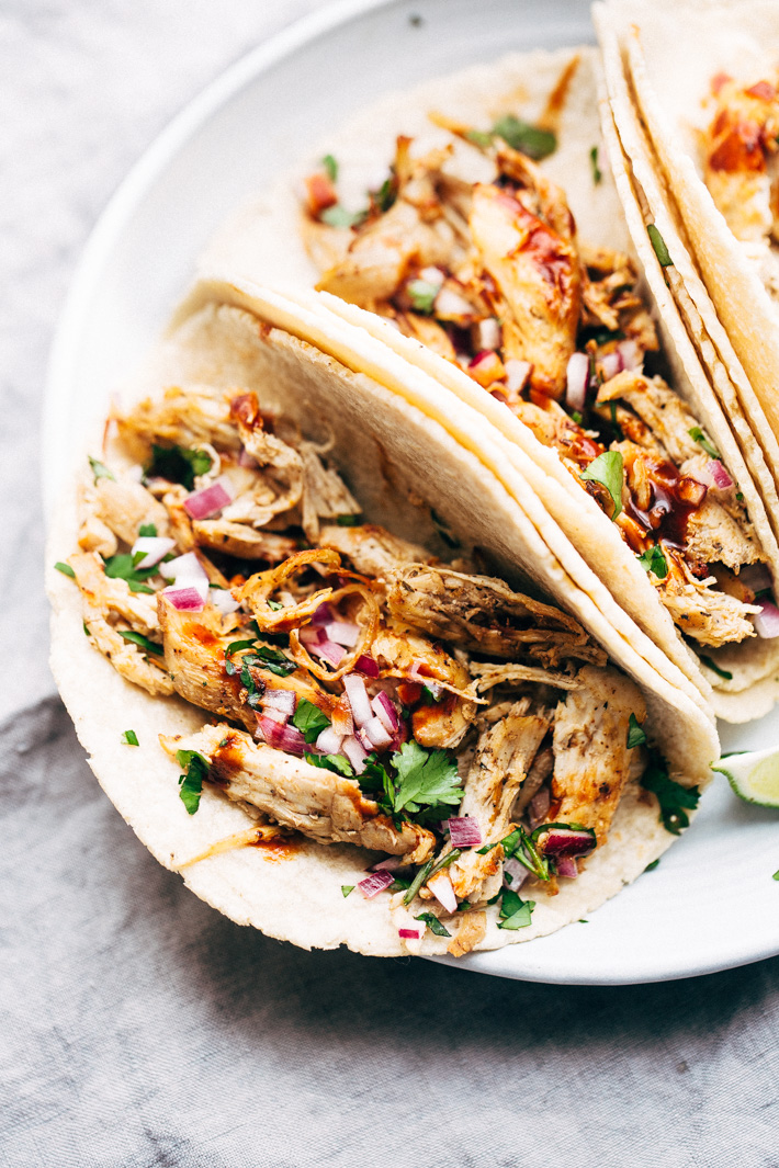 Pressure Cooker Crispy Chicken Carnitas - The easiest way to make carnitas! This instant pot recipe makes the most delicious carnitas! Top with lots of cilantro, onions, sautéed cabbage, and homemade chipotle sauce! #instantpot #carnitas #chickencarnitas #pressurecooker | Littlespicejar.com