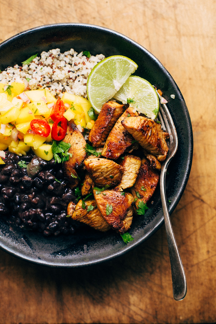 Cuban Mojo Chicken Quinoa Bowls with Mango Salsa and Black Beans - These bowls are bright and flavorful! The perfect quick meal to prep and enjoy all week long! The flavors just get better with time! #cubanchicken #mojochicken #chickenquinoabowls #quinoa | Littlespicejar.com