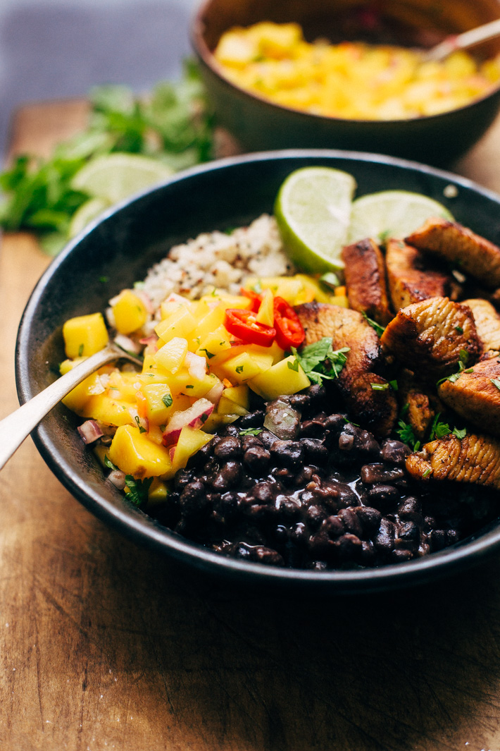 Cuban Mojo Chicken Quinoa Bowls with Mango Salsa and Black Beans - These bowls are bright and flavorful! The perfect quick meal to prep and enjoy all week long! The flavors just get better with time! #cubanchicken #mojochicken #chickenquinoabowls #quinoa | Littlespicejar.com