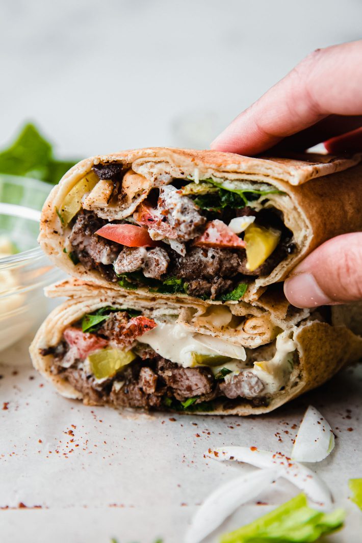 stacked beef shawarma on parchment