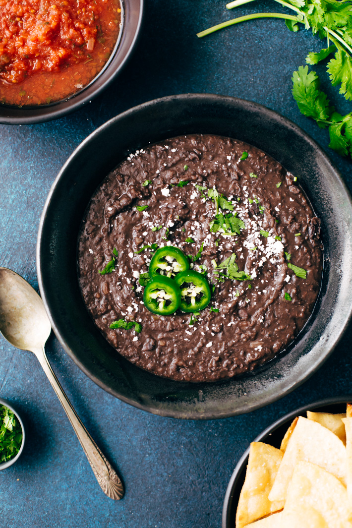 Spiced Up Refried Black Beans - learn how to make restaurant style black beans at home right in your instant pot! #instantpot #refriedblackbeans #refriedbeans #blackbeans | Littlespicejar.com
