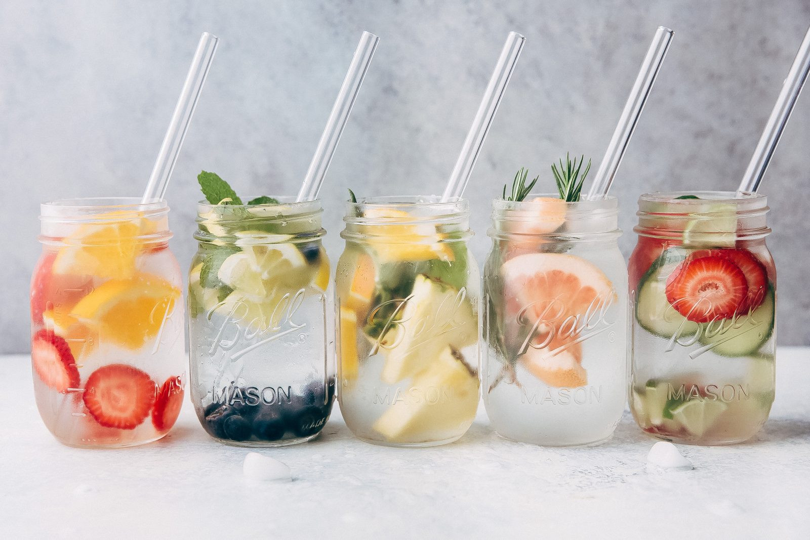 5 Infused Waters to Sip on This Summer - 5 recipes for infused water that you can enjoy all summer long! A great alternative to carbonated beverages and it's prettier to look at too! #infusedwater #water #infusedwaterrecipe | Littlespicejar.com