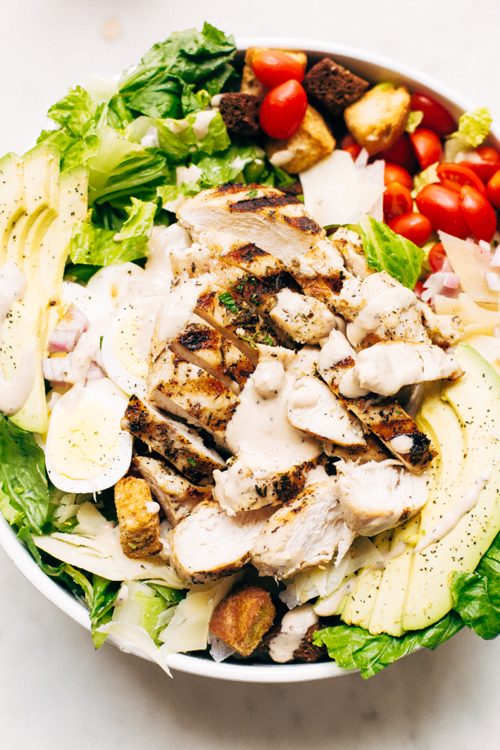 Grilled Romaine Chicken Caesar Cobb Salad - This salad combines all the things you love about a Cobb salad and all the things you love about a caesar salad! We're grilling the chicken and the romaine for more added flavor! #caesarsalad #caesarcobbsalad #cobbsalad #salad | LIttlespicejar.com