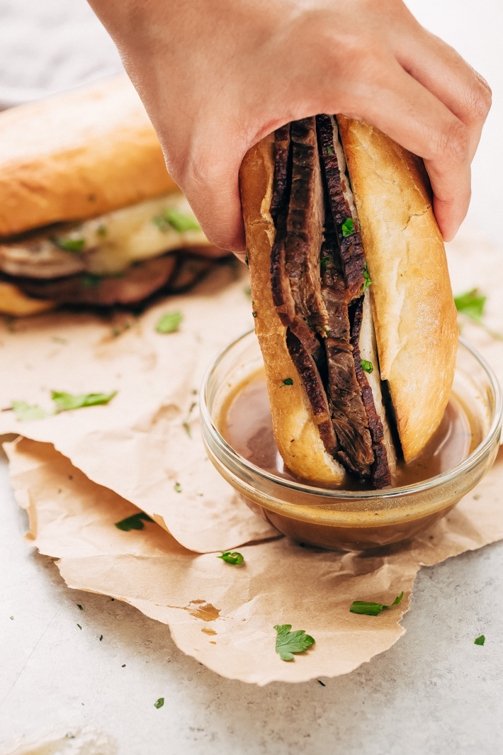 Slow Cooker French Dip Sandwiches - Tender beef that's slow cooked in au jus. These sandwiches are to die for! #frenchdip #frenchdipsandwich #frenchdipsandwiches #slowcooker #crockpot | Littlespicejar.com