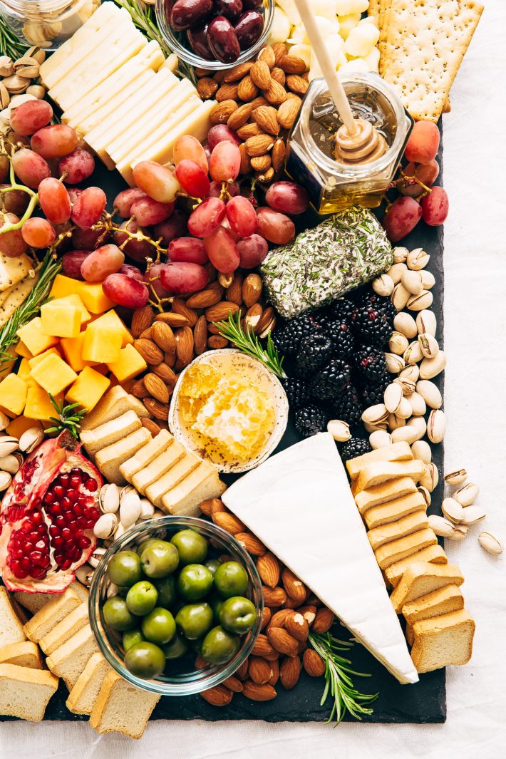 How to make an EPIC Holiday Cheese Board - Learn step-by-step how to put together the best cheese board your guests have seen! #holidaycheeseboard #cheeseboard #cheeseplatter #cheeseplate #cheeseandfruitplate | Littlespicejar.com