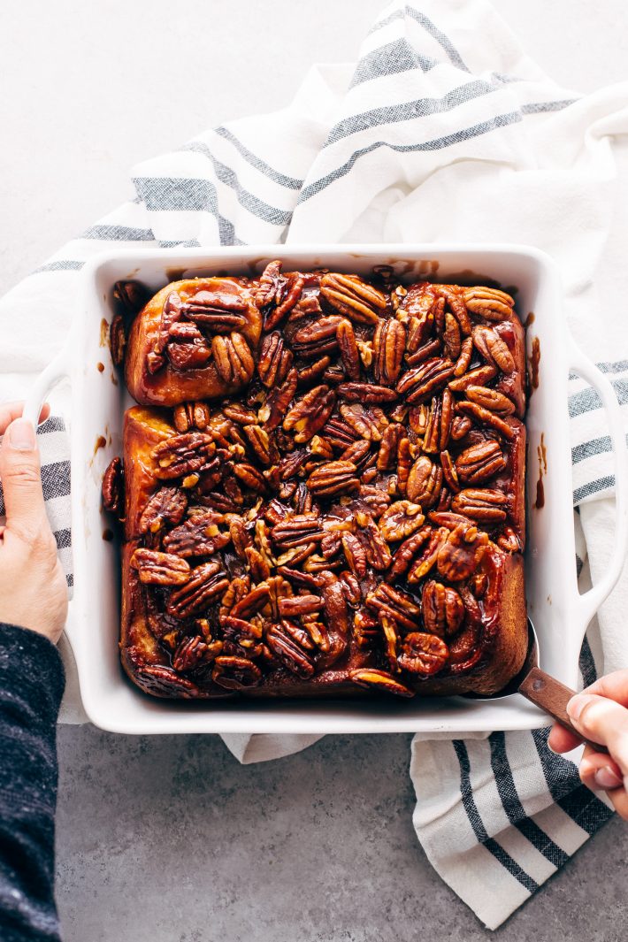 Gooey Pecan Sticky Buns - Learn how to make sticky buns at home from scratch. These sticky buns have a caramel pecan topping and swirls of cinnamon inside! #stickybuns #maplepecanstickybuns #pecanstickybuns #cinnabon #cinnamonrolls | Littlespicejar.com