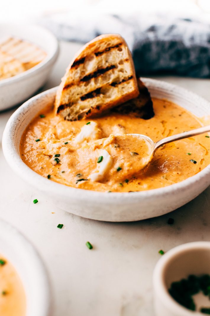 Blushing Tomato Crab Bisque - made with roasted veggies and tons of fresh herbs and spices! This soup is perfect as a starter or main course! #easter #crabbisque #tomatocrabbisque #tomatobisque #crabchowder | Littlespicejar.com