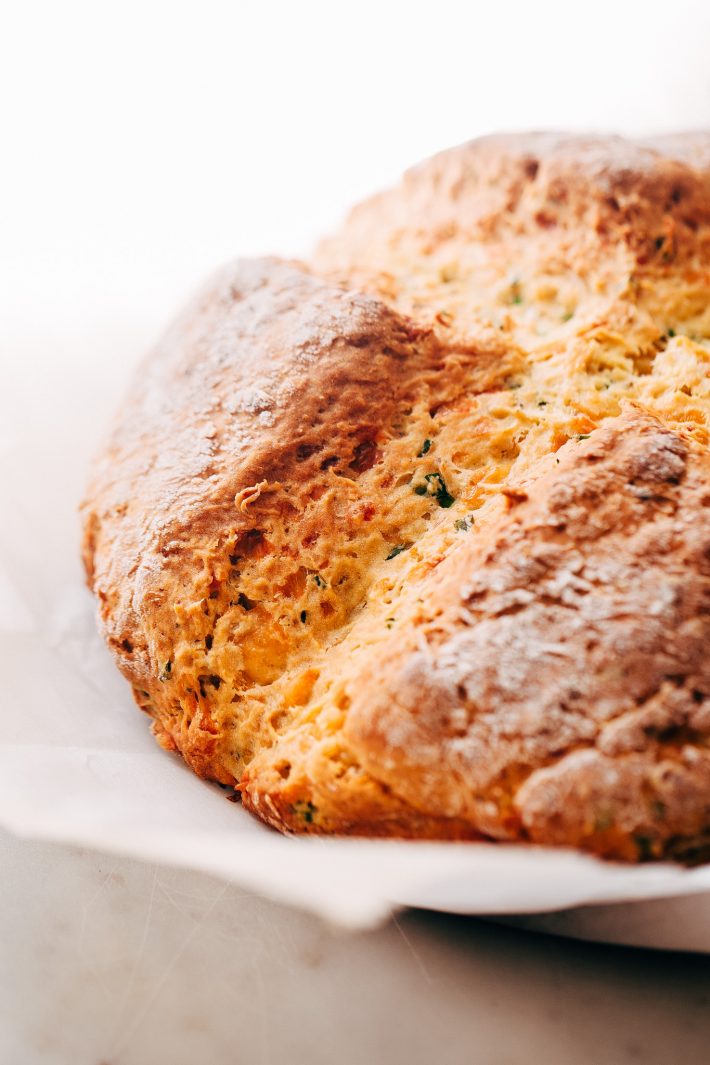 Garlic Irish Cheddar Chive Soda Bread - learn how to make a savory soda bread! This recipe is easy and takes just 10 minutes of hands on time! #cheddarsodabread #chivesodabread #garlicsodabread #irishsodabread #sodabread | Littlespicejar.com