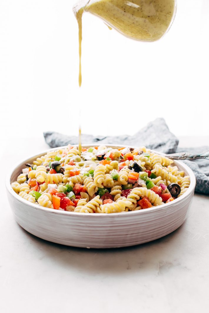 California Pasta Salad - made with homemade roasted garlic Italian dressing and tons of yummy salad toppings! Perfect for potlucks or picnics! #pastasalad #californiasalad #salad #spaghettisalad #potluck #choppedsalad | Littlespicejar.com