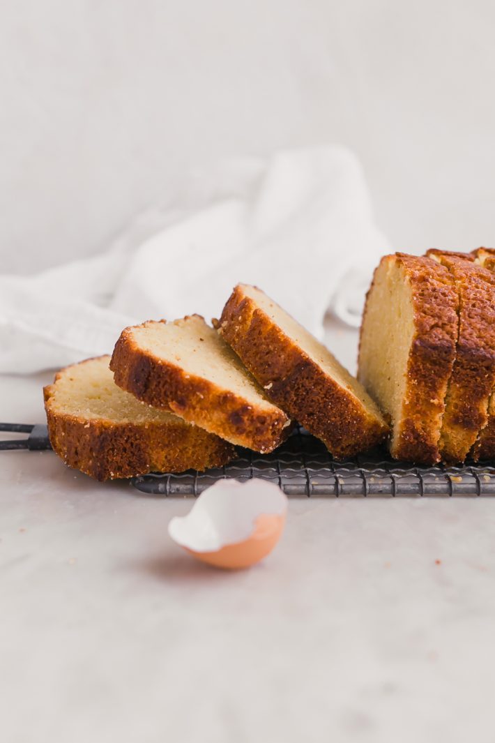 One Bowl Lemon Olive Oil Pound Cake - Learn how to make the easiest lemon olive oil pound cake in just one bowl! It takes 5 minutes to whisk together thats all! #oliveoilpoundcake #poundcake #lemonoliveoilpoundcake | Little Spice Jar