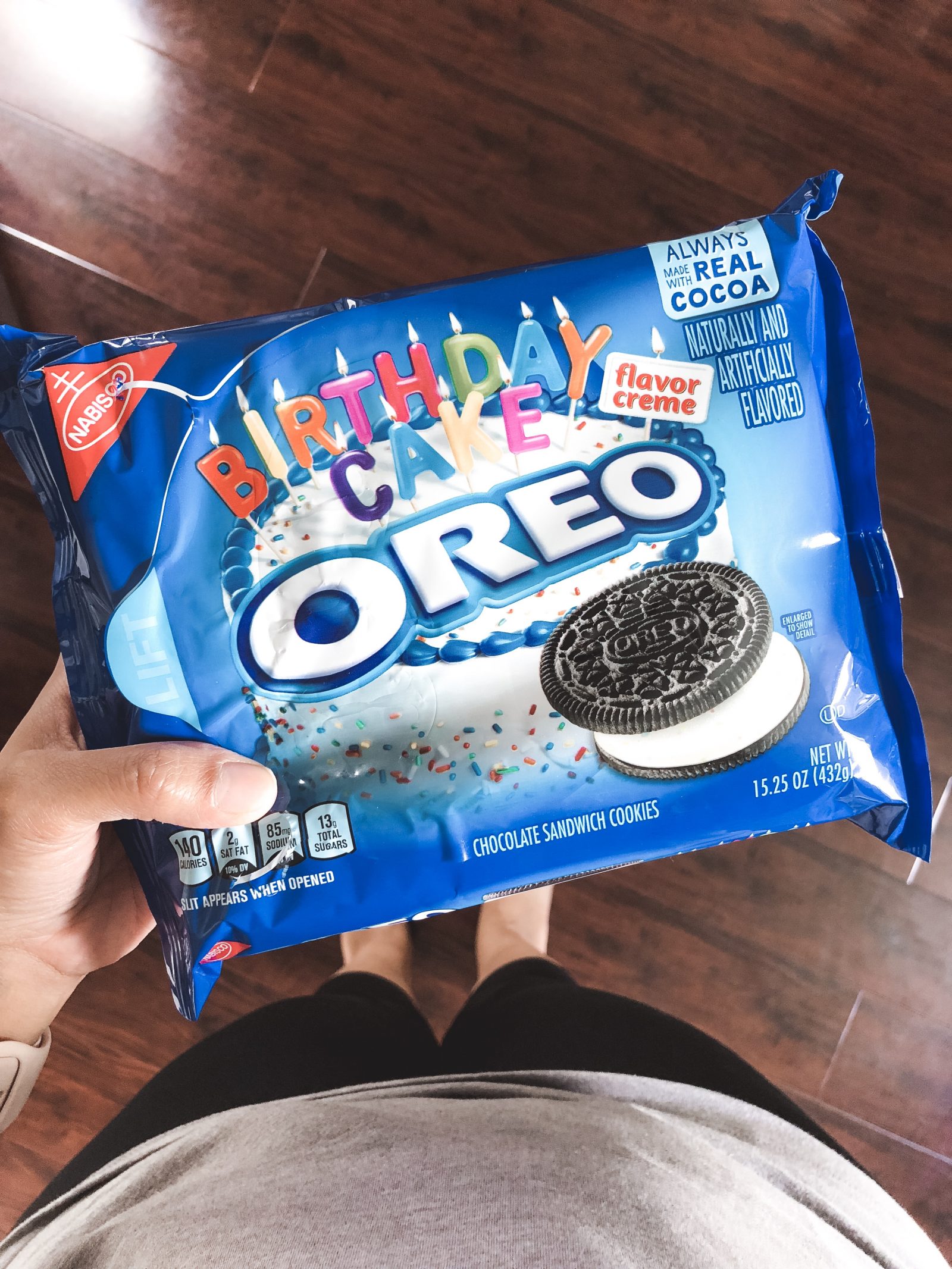 hand holding birthday cake Oreo in package