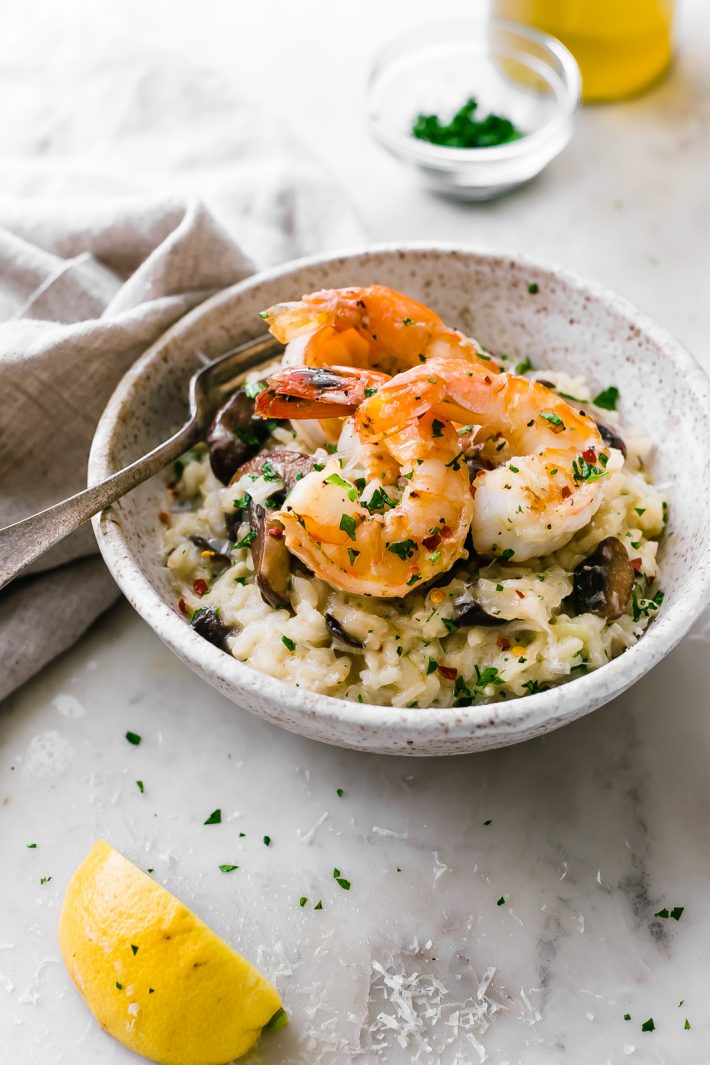 Mushroom Parmesan Shrimp Risotto - Learn how to make shrimp risotto at home with ease! Loaded with sautéed mushrooms, shrimp and tons of garlic! #shrimprisotto #mushroomrisotto #parmesanrisotto #homemaderisotto | Littlespicejar.com