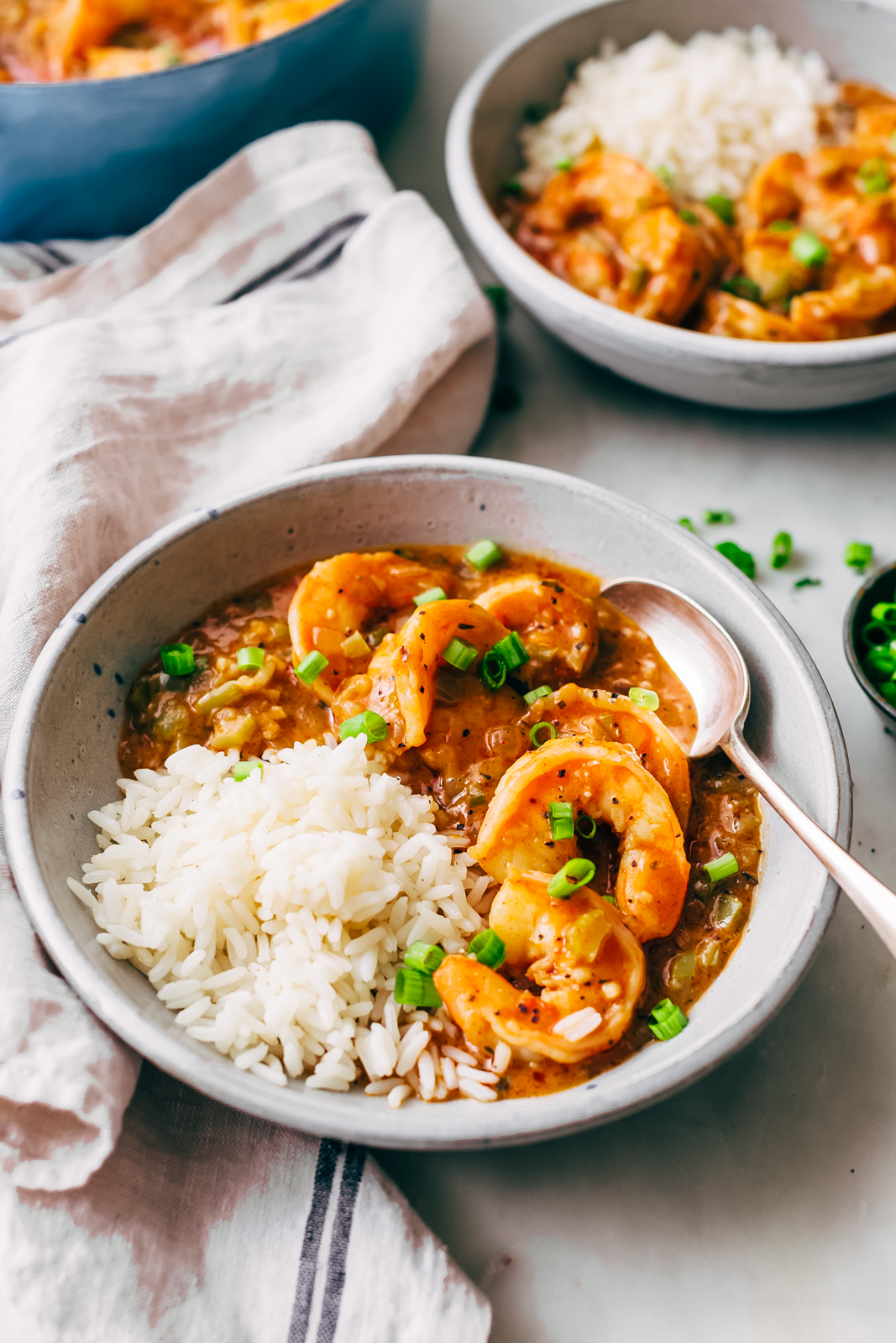 shrimp étouffée bowls with rice on white marble