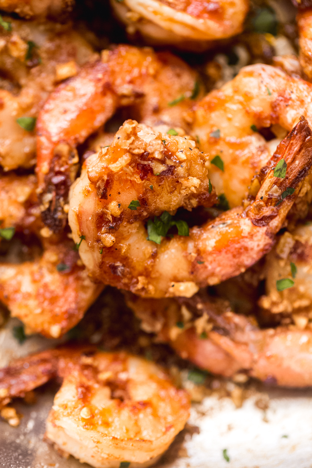 close up of cooked shrimp in sweet garlic mixture