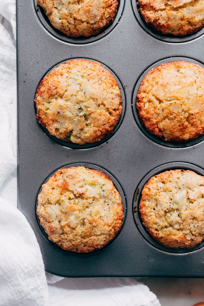 muffin pan with freshly baked lemon zucchini muffins
