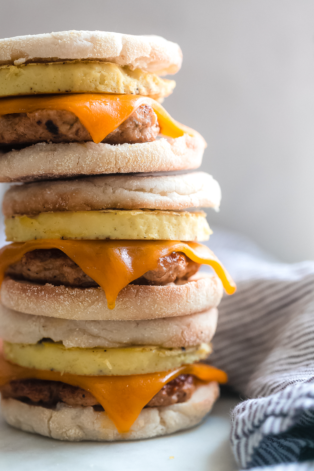 close up stack of three breakfast sandwiches