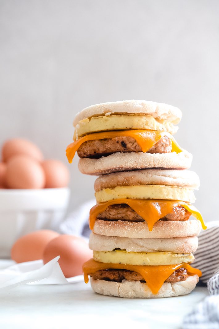 stack of freezer breakfast sandwiches on white marble