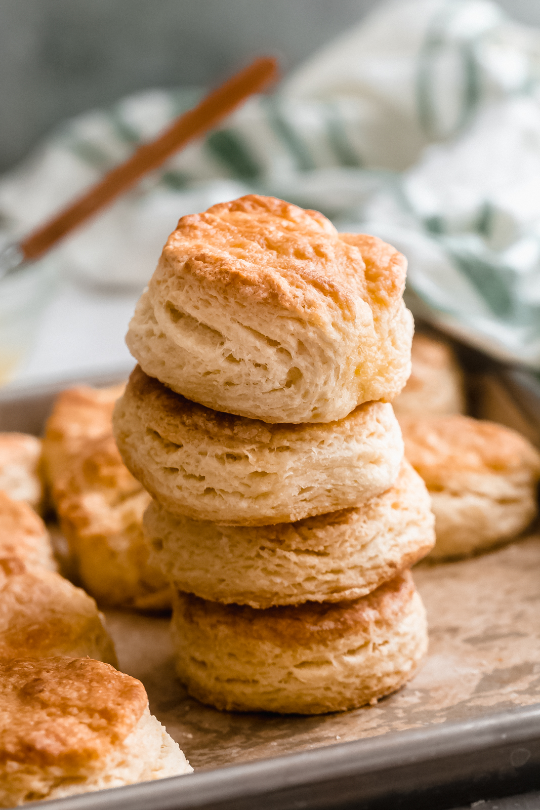 stack of leaning biscuits showing layers on sheet pan
