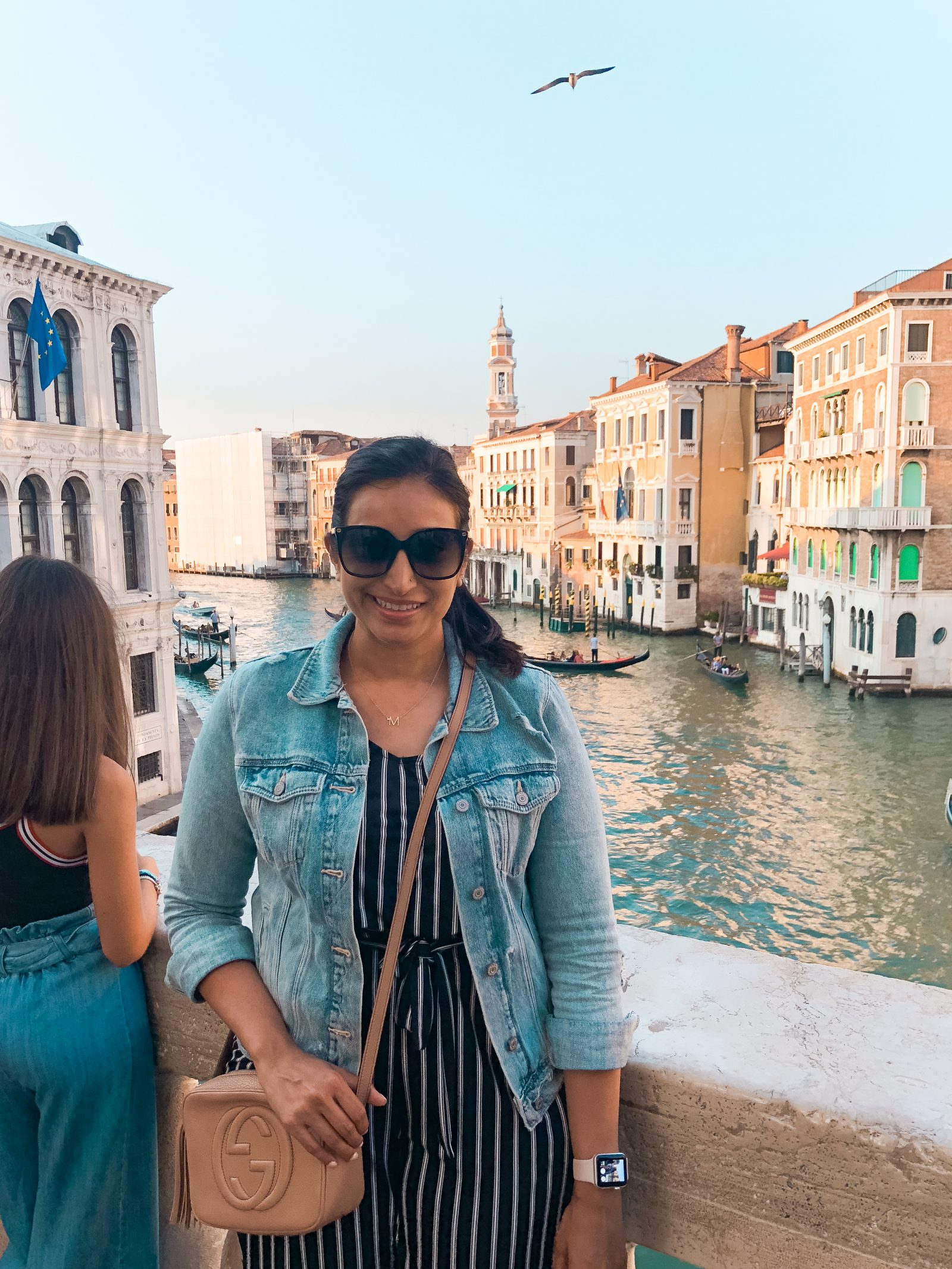 a picture of me with the canals and a gondola in the background