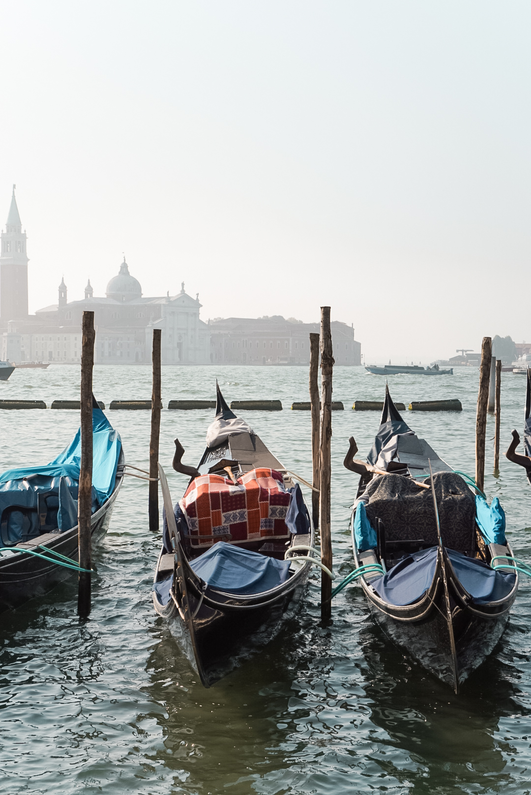 gondolas on the water in early morning light