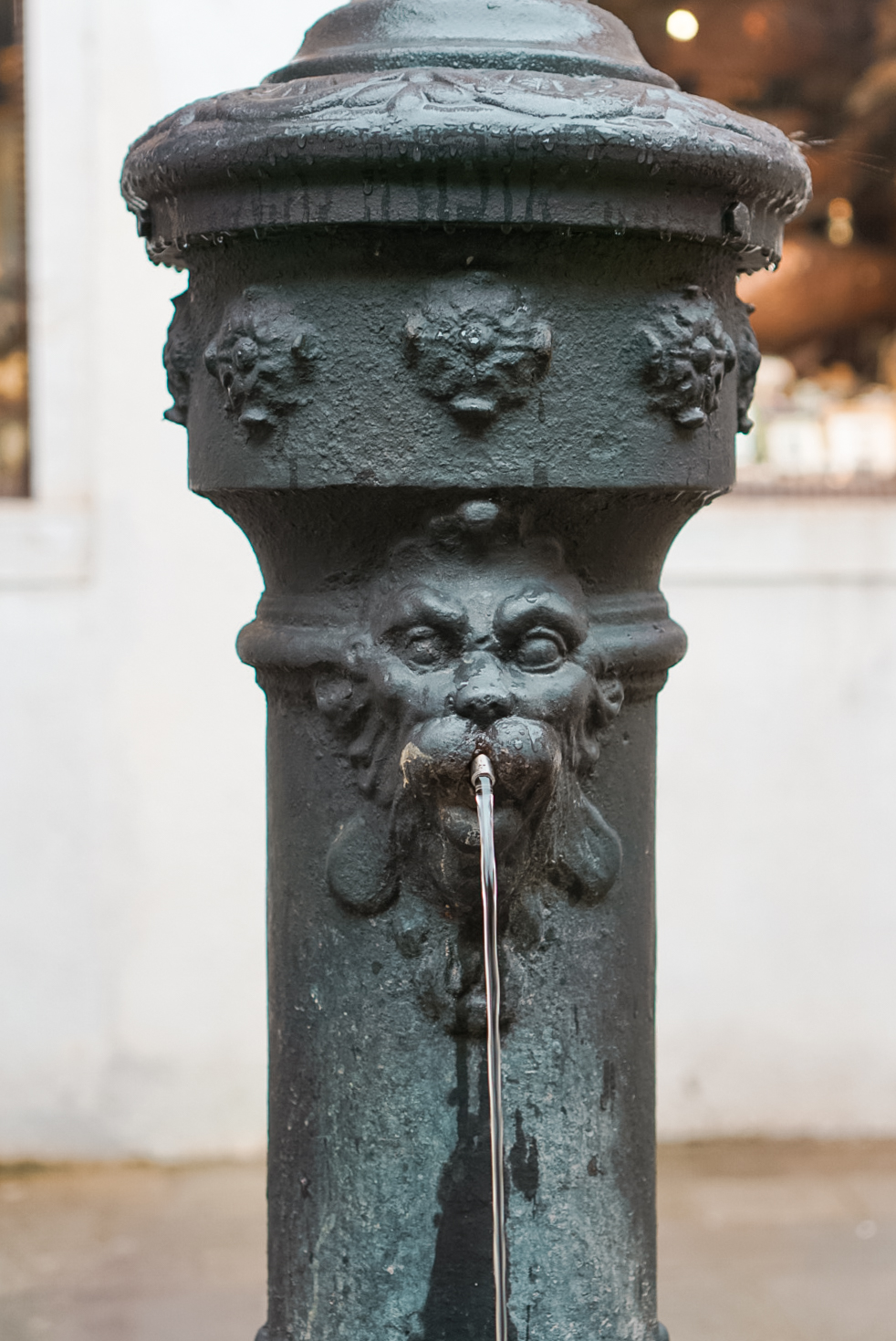 free flowing water through a an iron water fountain