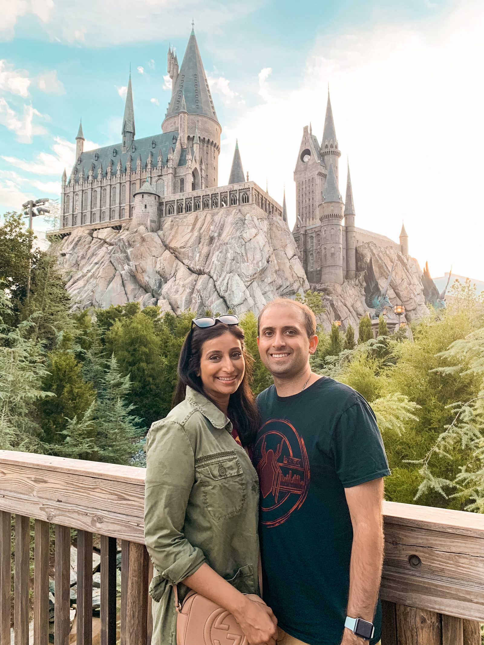 a picture of hubby and me outside Hogwarts at Wizarding World of Harry Potter