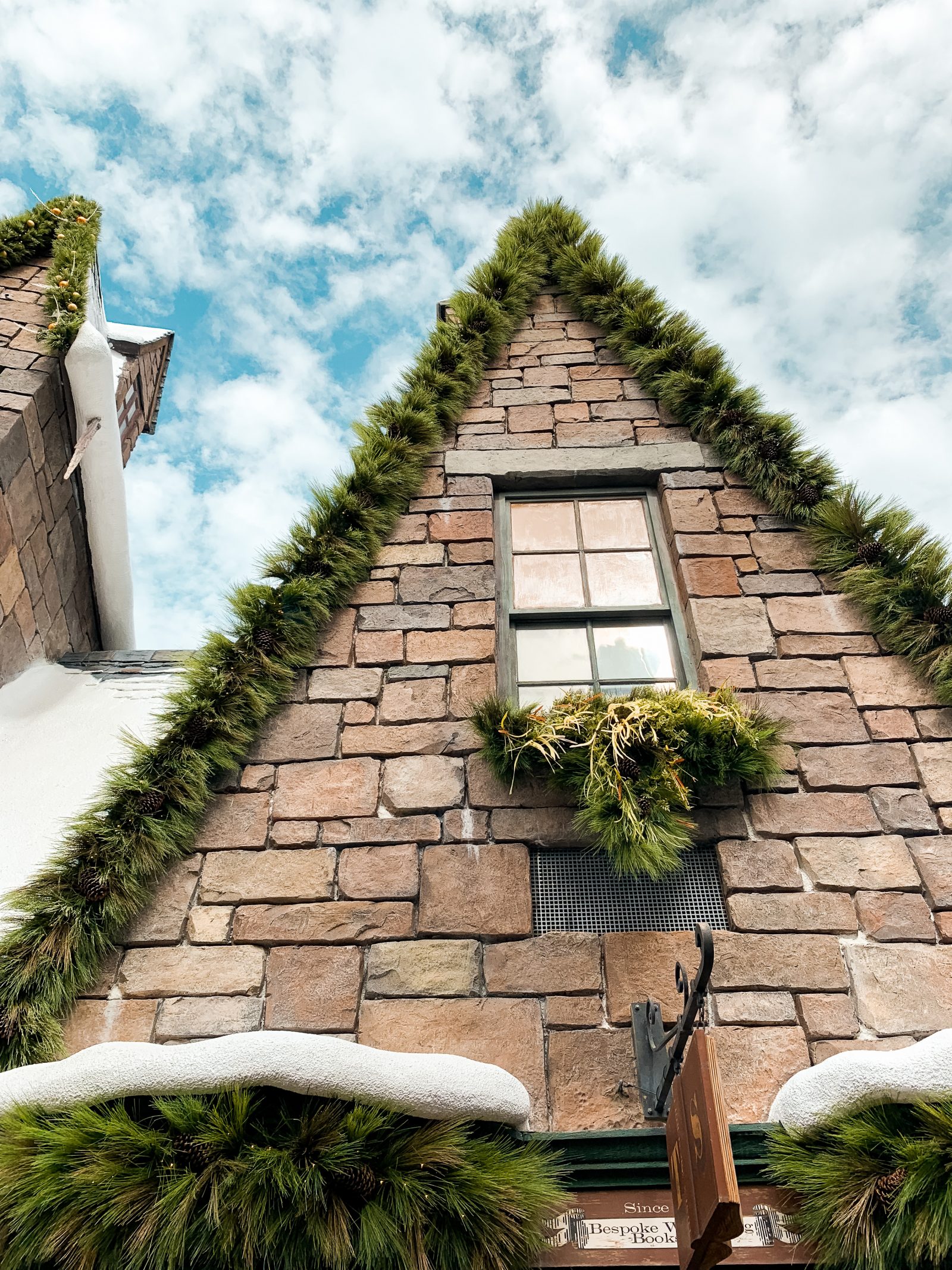 snowy store fronts In Hogmeade Wizarding World of Harry Potter