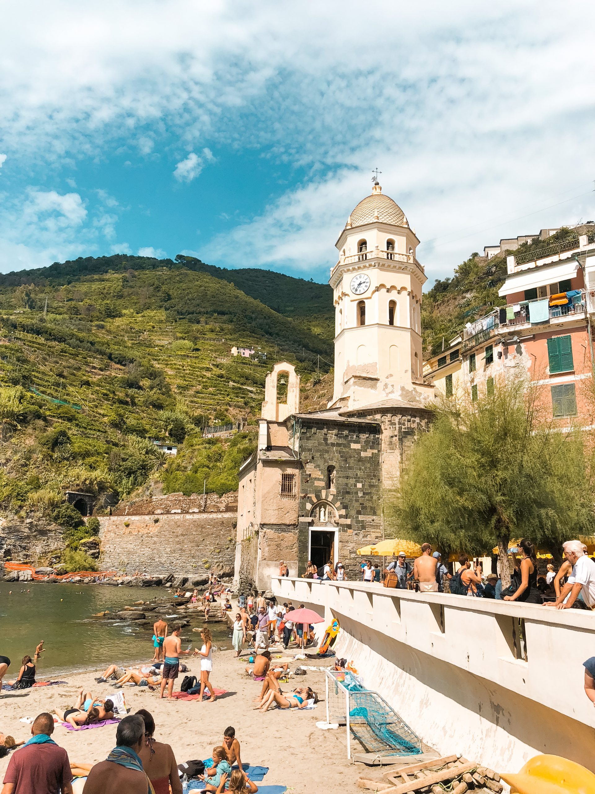 the iconic yellow building in the harbor of Vernazza