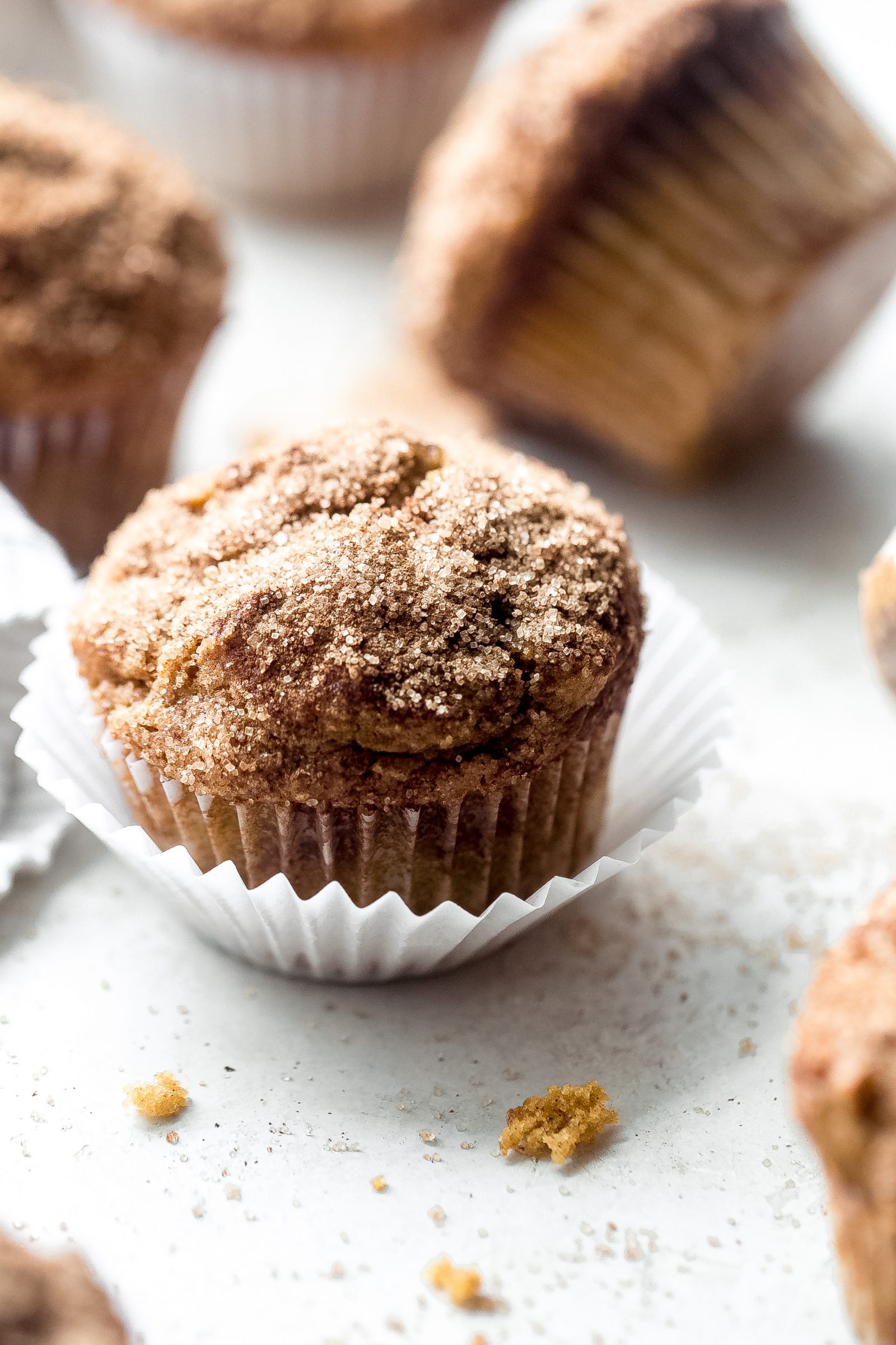 close up of pumpkin muffin sprinkled with cinnamon sugar on top