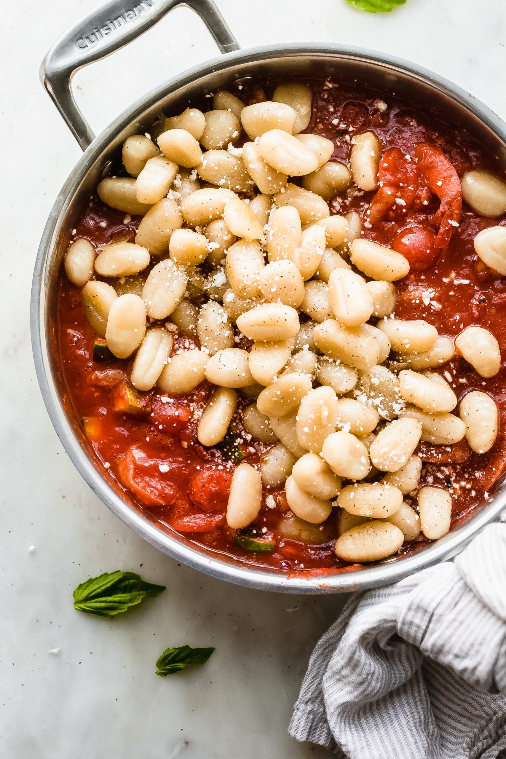 pomodoro sauce topped with shrimp and gnocchi 