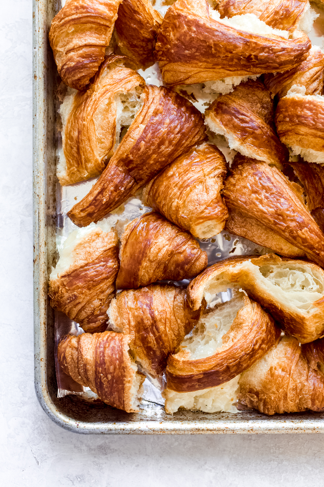 broken croissant on baking sheet lined with foil