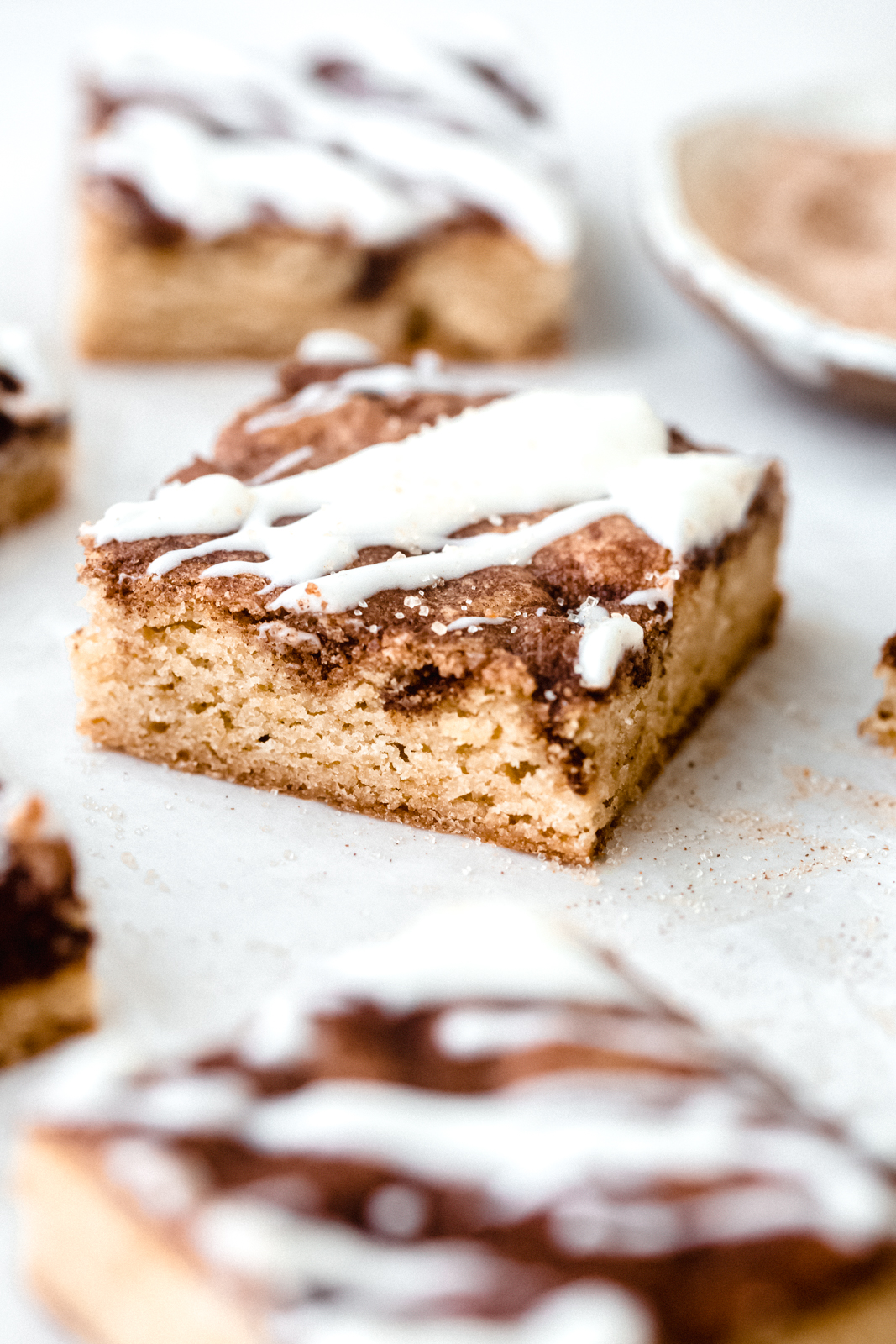 close up of cinnamon blondies topped with icing