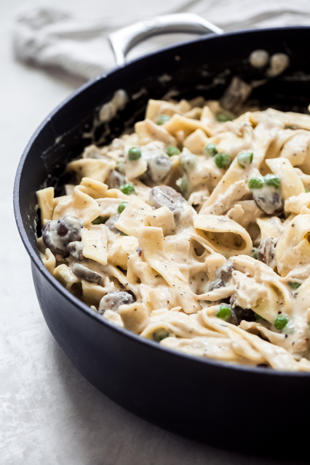noodles, peas, turkey, and mushrooms in a creamy sauce