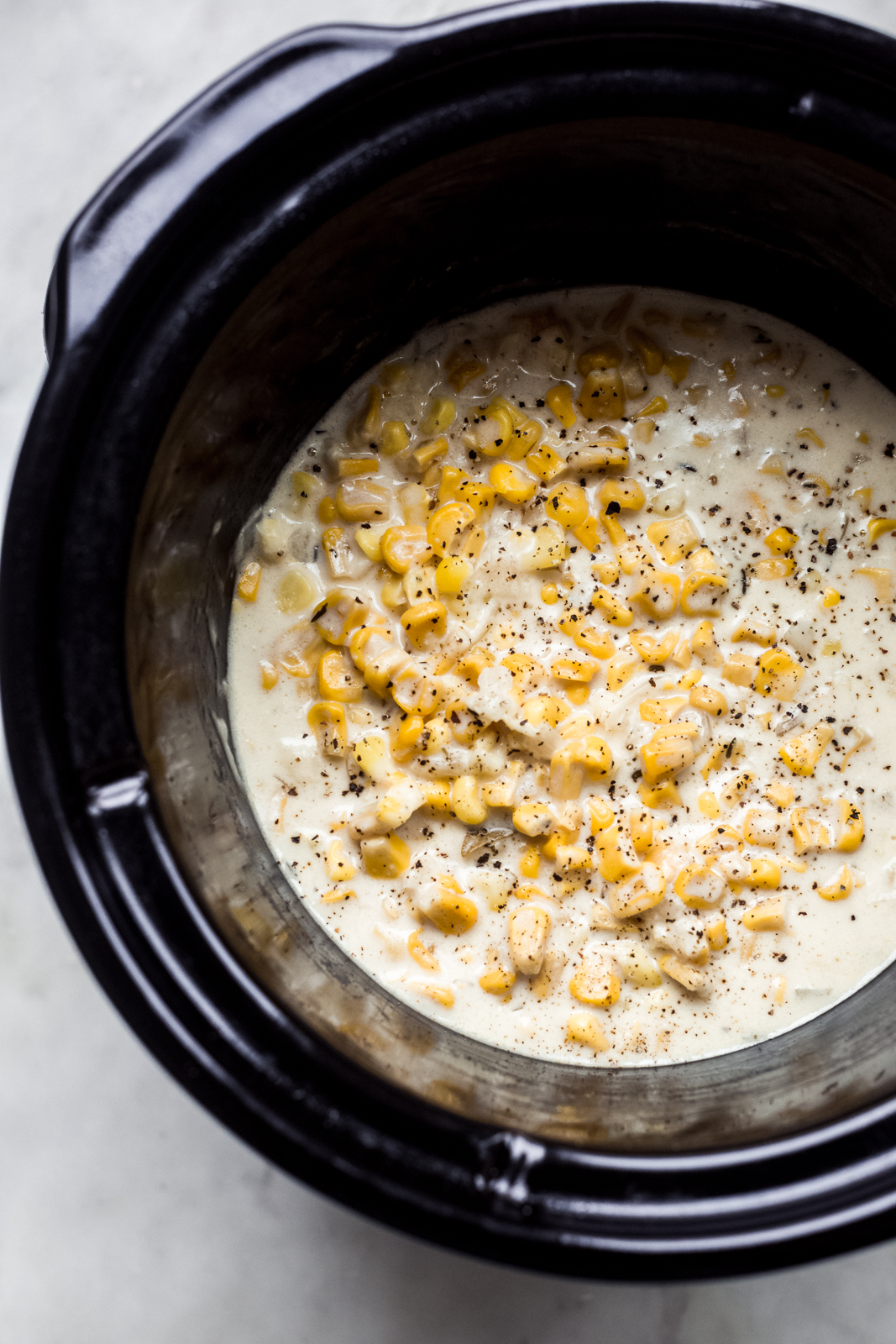 prepared creamed corn in slow cooker bowl
