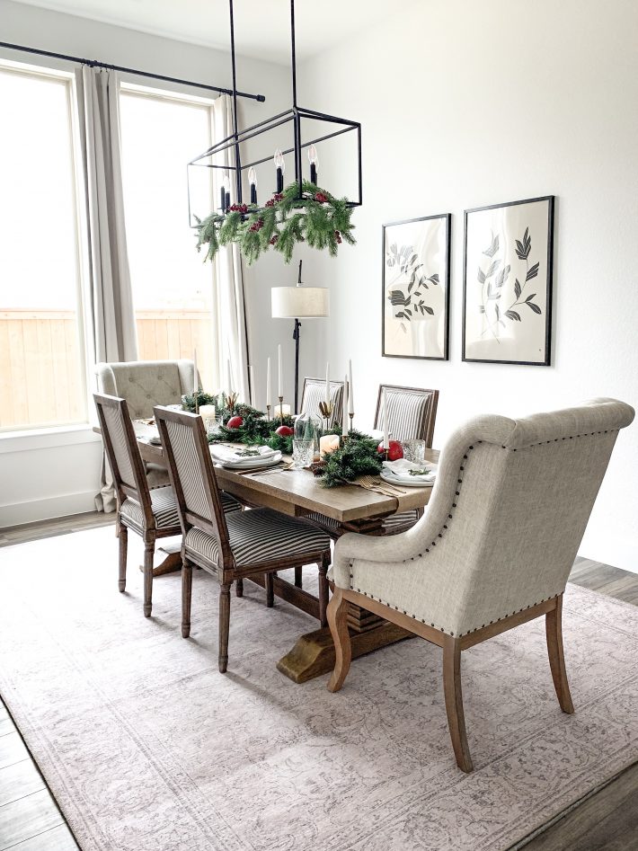 photo of festive decorated dining room with greens and reds