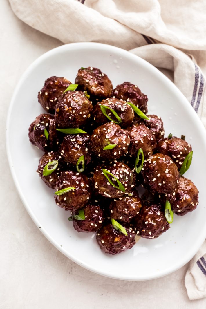 prepared beef meatballs in Mongolian sauce on white oval dish