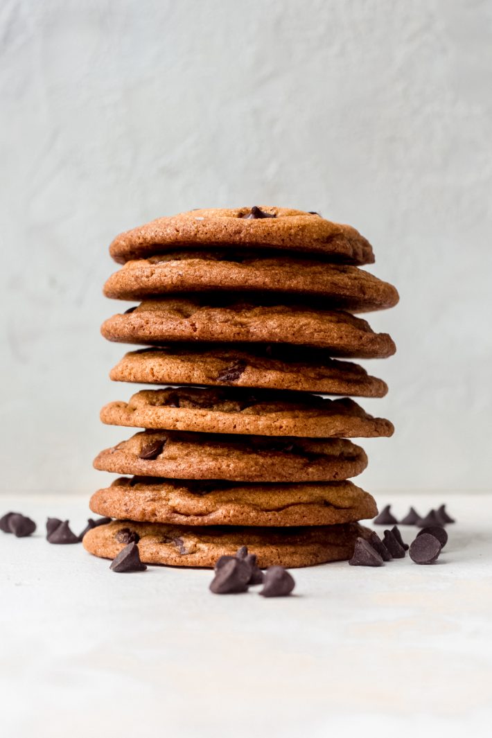 a stack of cookies with scattered chocolate chips