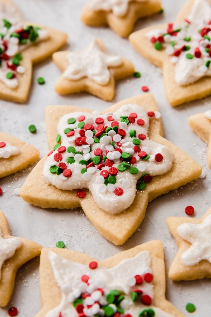 sugar cookies with frosting and Christmas sprinkles