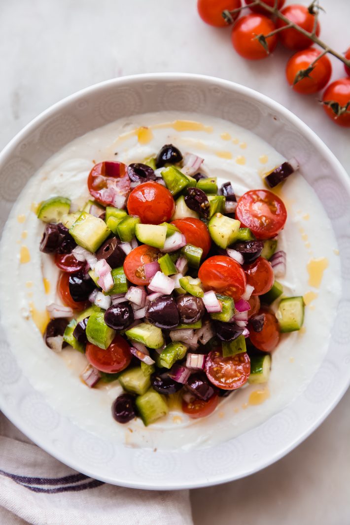 whipped feta dip topped with greek salad