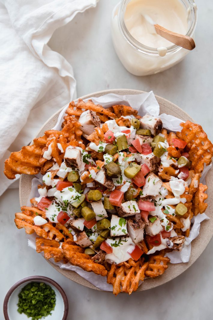 chicken shawarma fries plate on white marble