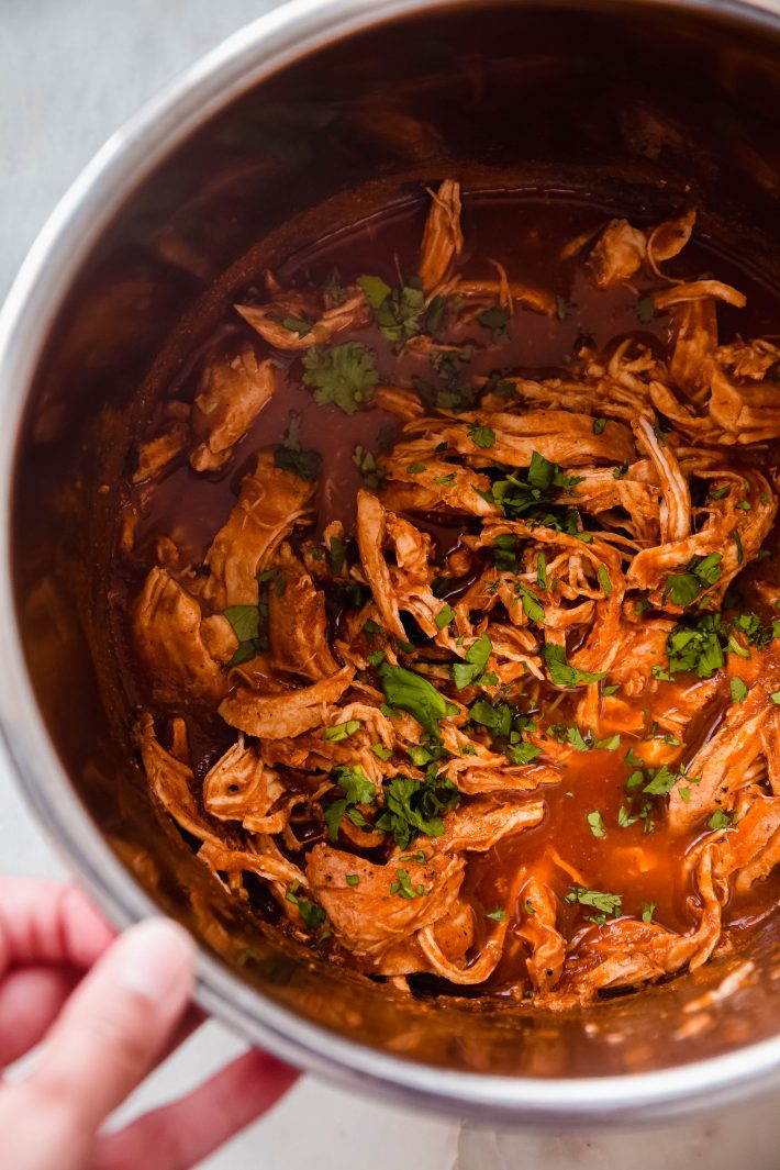 shredded Chicken Tinga in instant pot topped with cilantro