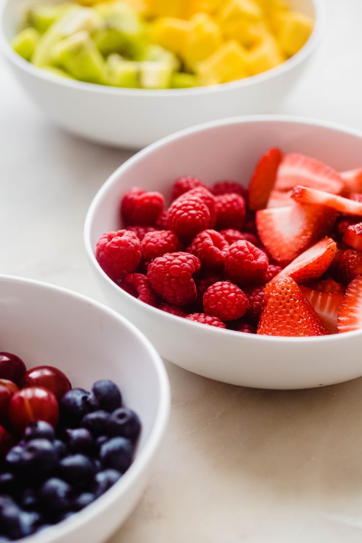 fresh fruit in white bowls