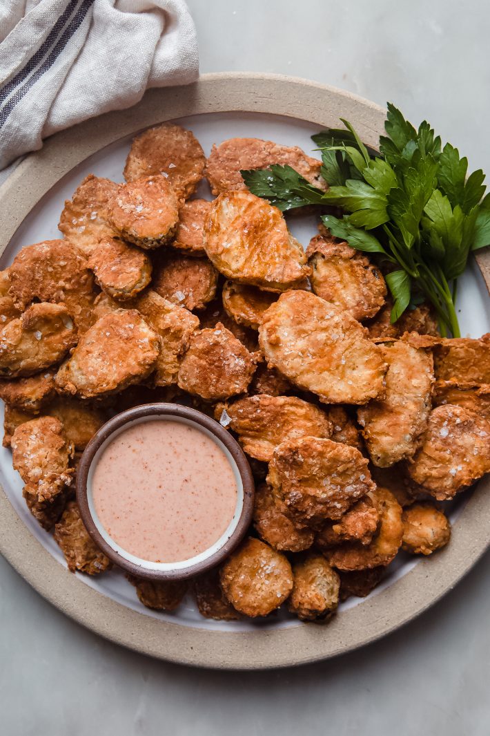 fried pickles with remoulade on plate with parsley