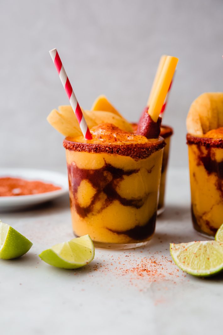 Chamango on white marble with tajin rim and lime wedges
