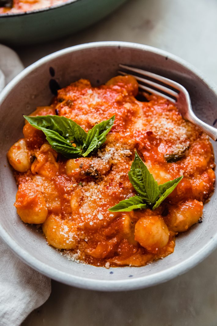 gnocchi alla Sorrentina in bowl with parmesan and basil