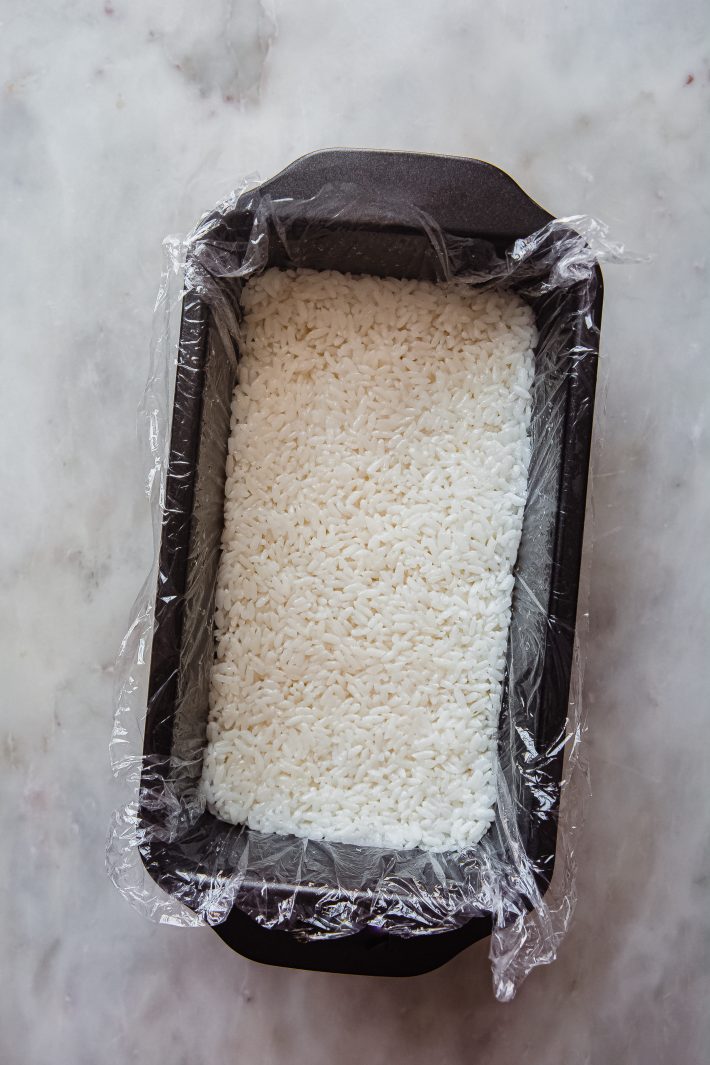 rice packed into baking dish