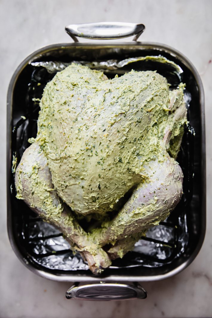 butter rubbed turkey in roasting pan